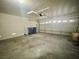 Garage featuring concrete flooring, painted walls, and a garage door ready for parking at 11953 Haven St, Las Vegas, NV 89183