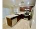 Eat-in kitchen boasts stainless appliances, tile countertops, and dark cabinetry at 11953 Haven St, Las Vegas, NV 89183