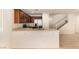 Open kitchen with stainless steel appliances, tile countertops, and lots of natural light at 11953 Haven St, Las Vegas, NV 89183