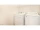 Laundry room with a washer, dryer, and wire shelving for storage at 11953 Haven St, Las Vegas, NV 89183