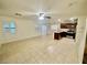 Open-concept living area with tile flooring, shutters, and bright natural light at 11953 Haven St, Las Vegas, NV 89183