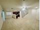 Bright living space with tile flooring, shutters, stairs, and easy access to the kitchen at 11953 Haven St, Las Vegas, NV 89183