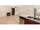 Open floor plan shows the living room with a fireplace and the kitchen with stainless appliances at 11953 Haven St, Las Vegas, NV 89183