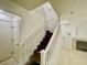 Staircase featuring dark wood treads and white risers and railing at 11953 Haven St, Las Vegas, NV 89183