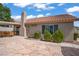 Attractive backyard featuring a patio, lush landscaping, and mature trees at 1219 Heather Oaks Way, North Las Vegas, NV 89031