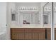 Bathroom with double sinks, a large mirror, and a vanity with storage at 1219 Heather Oaks Way, North Las Vegas, NV 89031