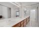 Bright bathroom featuring double sinks, a large mirror, and modern lighting at 1219 Heather Oaks Way, North Las Vegas, NV 89031