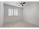 This bedroom is well-lit and boasts neutral colors and a ceiling fan at 1219 Heather Oaks Way, North Las Vegas, NV 89031