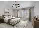 Serene bedroom with neutral tones, ceiling fan, plantation shutters, and natural light at 1219 Heather Oaks Way, North Las Vegas, NV 89031
