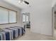 Cozy bedroom with a comfortable bed, ample natural light, and a mirrored closet at 1219 Heather Oaks Way, North Las Vegas, NV 89031