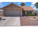 Charming single-story home featuring a well-maintained front yard and a two-car garage at 1219 Heather Oaks Way, North Las Vegas, NV 89031
