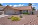 This charming home boasts a well-maintained front yard with colorful flowers and low maintenance landscaping at 1219 Heather Oaks Way, North Las Vegas, NV 89031