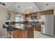 Beautiful eat-in kitchen featuring a breakfast bar and stainless steel appliances at 1219 Heather Oaks Way, North Las Vegas, NV 89031