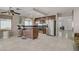 Eat-in kitchen featuring a breakfast bar, stainless steel appliances, and tile floors at 1219 Heather Oaks Way, North Las Vegas, NV 89031