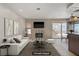Cozy living room with fireplace, TV, plush seating, and sliding glass doors to backyard at 1219 Heather Oaks Way, North Las Vegas, NV 89031