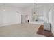 Open concept living room featuring tile flooring and pendant lights at 1219 Heather Oaks Way, North Las Vegas, NV 89031