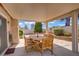 Covered patio with a dining table and chairs for outdoor enjoyment at 1219 Heather Oaks Way, North Las Vegas, NV 89031