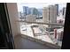 Balcony view overlooking the city skyline and featuring clear glass railings at 145 E Harmon Ave # 27621, Las Vegas, NV 89109