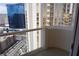 Balcony view showcasing other high-rise buildings and street views in the city at 145 E Harmon Ave # 27621, Las Vegas, NV 89109