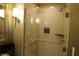 Clean tiled bath with glass shower at 145 E Harmon Ave # 27621, Las Vegas, NV 89109