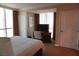 Bedroom with desk and a comfortable bed at 145 E Harmon Ave # 27621, Las Vegas, NV 89109