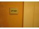Hallway shot showcasing unit number sign on the wall outside the door to the condo at 145 E Harmon Ave # 27621, Las Vegas, NV 89109