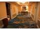 Well-maintained hallway featuring elegant carpeting and neutral wall colors with accents at 145 E Harmon Ave # 27621, Las Vegas, NV 89109