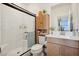 Modern bathroom with a glass-enclosed shower, and vanity with neutral design at 1474 Whistling Kite St, Las Vegas, NV 89138