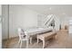 Bright dining area with modern table, chairs, and bench seating, ideal for Gathering meals at 1474 Whistling Kite St, Las Vegas, NV 89138