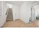 Open hallway with hardwood floors, a staircase, and neutral decor at 1474 Whistling Kite St, Las Vegas, NV 89138