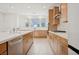 Bright kitchen with sleek countertops, stainless steel appliances, and light wood cabinetry for a clean and modern look at 1474 Whistling Kite St, Las Vegas, NV 89138