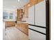 This kitchen boasts modern appliances, light wood cabinetry, stylish tile backsplash, and spacious layout at 1474 Whistling Kite St, Las Vegas, NV 89138