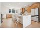 Bright, modern kitchen featuring an island with seating and modern appliances at 1474 Whistling Kite St, Las Vegas, NV 89138