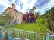 Private backyard with a large lawn, mature landscaping, and a house with a neutral color scheme at 1515 Fort Dix Cir, North Las Vegas, NV 89031