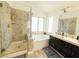 Modern bathroom with walk-in shower, soaking tub, and sleek fixtures at 1515 Fort Dix Cir, North Las Vegas, NV 89031