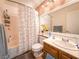 Cozy bathroom featuring a shower-tub combo, floral shower curtain, and decor at 1515 Fort Dix Cir, North Las Vegas, NV 89031