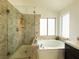 Modern bathroom with walk-in shower, soaking tub, and sleek fixtures at 1515 Fort Dix Cir, North Las Vegas, NV 89031