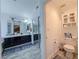 Modern bathroom with double sinks, large mirror, and cabinet storage at 1515 Fort Dix Cir, North Las Vegas, NV 89031