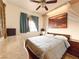 Comfortable bedroom with ceiling fan and canyon-themed wall art at 1515 Fort Dix Cir, North Las Vegas, NV 89031