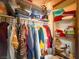 Well-organized closet featuring hanging clothes, folded items on shelves and ample storage space at 1515 Fort Dix Cir, North Las Vegas, NV 89031