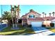 Charming two-story home with a well-maintained lawn and mature trees in a sunny neighborhood at 1515 Fort Dix Cir, North Las Vegas, NV 89031