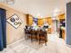Functional kitchen with oak cabinets, white countertops, and tiled floors at 1515 Fort Dix Cir, North Las Vegas, NV 89031
