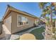 Backyard featuring manicured lawn, walkway, landscaping, and outdoor seating at 1609 Hidden Spring Dr, Las Vegas, NV 89117