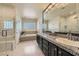 Luxurious bathroom with walk-in shower, soaking tub, and dual sinks at 1609 Hidden Spring Dr, Las Vegas, NV 89117