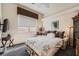 Comfortable bedroom with carpet, a side chair, and window at 1609 Hidden Spring Dr, Las Vegas, NV 89117