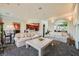Open living room with direct access to the kitchen and stone archway at 1609 Hidden Spring Dr, Las Vegas, NV 89117