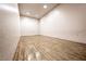 Private racquetball court features wood floor, white walls, and overhead lighting at 1609 Hidden Spring Dr, Las Vegas, NV 89117