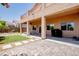 Expansive backyard featuring a covered patio, lush greenery, and a well-manicured lawn for outdoor entertainment at 1699 Sonoran Bluff Ave, Henderson, NV 89014
