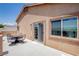 Outdoor patio table and chairs on a balcony offering neighborhood views and natural light at 1699 Sonoran Bluff Ave, Henderson, NV 89014