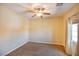 Clean and simple bedroom with neutral walls, plush carpet, and ample natural light from the window at 1699 Sonoran Bluff Ave, Henderson, NV 89014